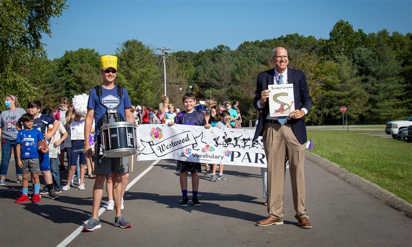 Students walk in a vocabulary parade